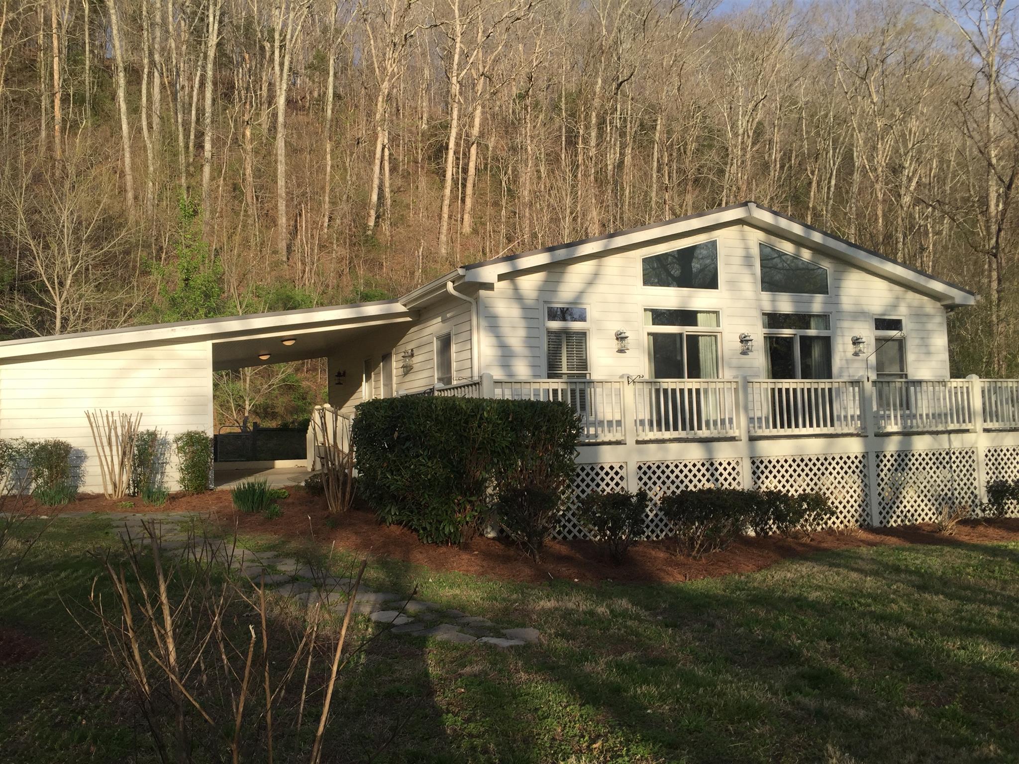 9370 Hester Beasley Road Nashville, TN 37221 - Photo 2 of 22 This View Shows the Carport to the Left and the Cottage with Deck Nestled Among the Trees.