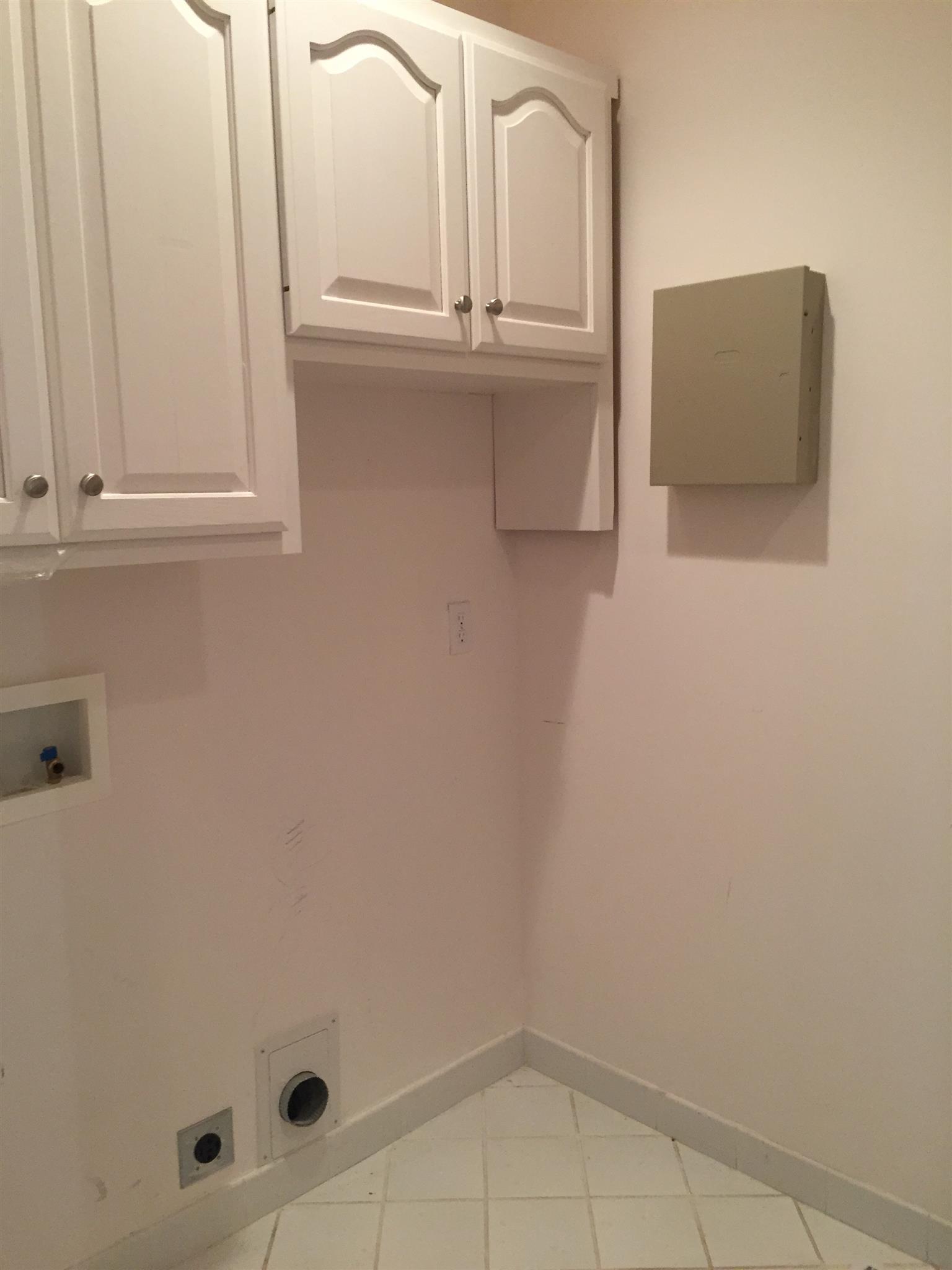 9370 Hester Beasley Road Nashville, TN 37221 - Photo 17 of 22 The Laundry Room is Spacious and Offers Extra Cabinets for Storage.