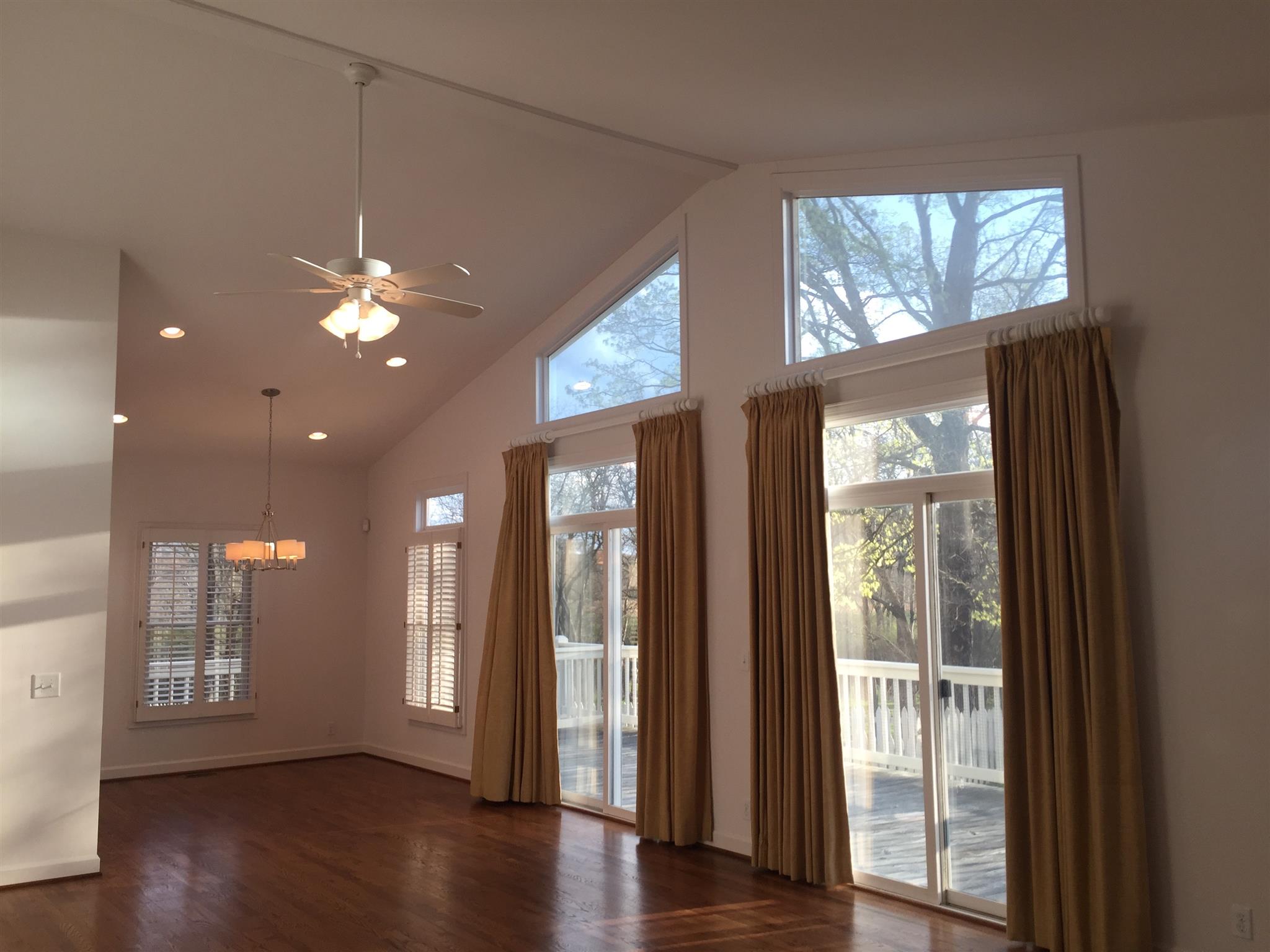 9370 Hester Beasley Road Nashville, TN 37221 - Photo 4 of 22 The Main Living Room Features a Vaulted Ceiling and a Wonderful Wall of Windows Filling this Space with Natural Light.