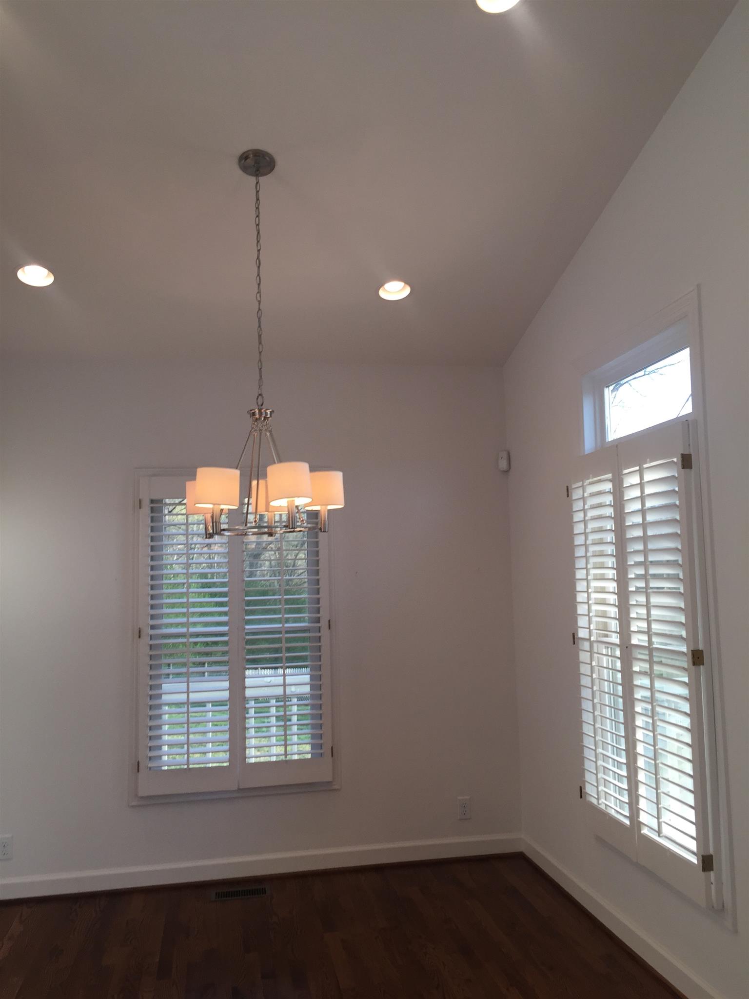 9370 Hester Beasley Road Nashville, TN 37221 - Photo 6 of 22 The Dining Room Sits Between the Leving Room and Kitchen and Has an Elegant Chrome and Barrel Shade Chandelier.