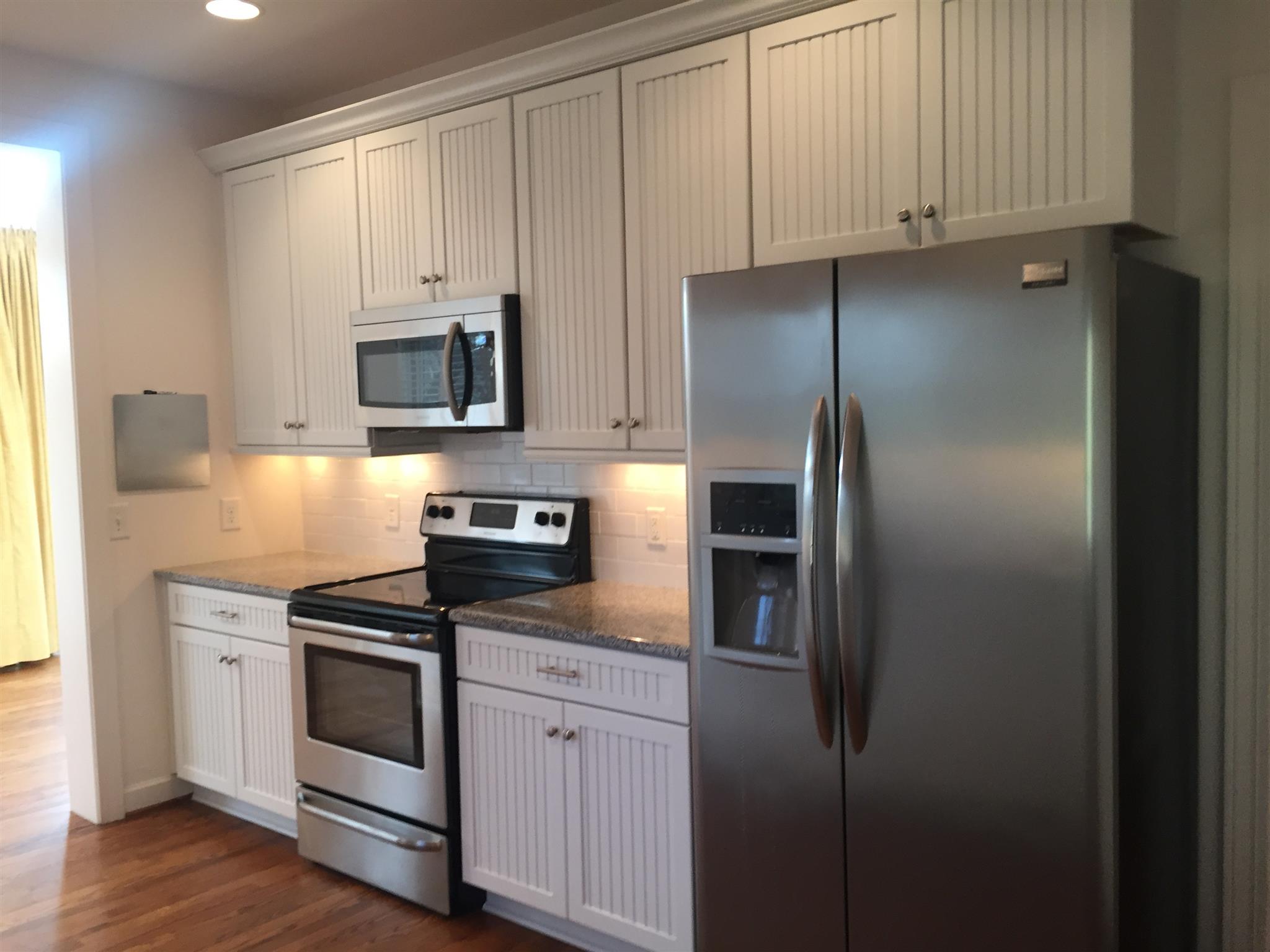 9370 Hester Beasley Road Nashville, TN 37221 - Photo 10 of 22 The Side by Side Stainless Steel Refrigerator Stays. Under Cabinet Lighting and Recessed Lighting Brighten This Cute Kitchen.