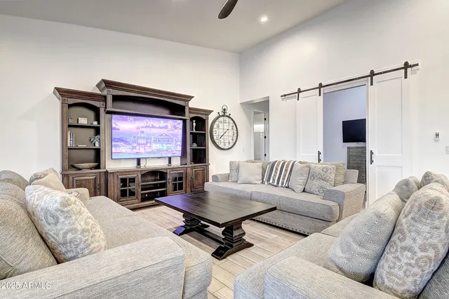 a spacious bedroom with a bed and a table in it