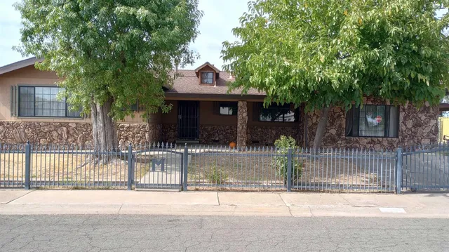 a view of a house with a iron gate
