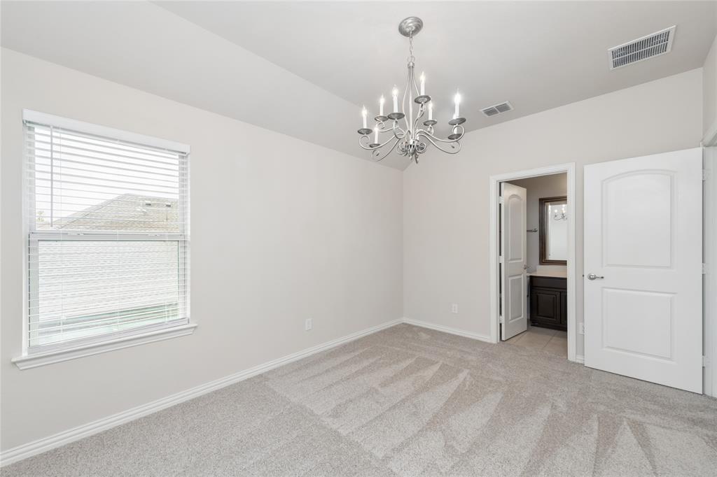 12571 Valley Spring Drive Frisco, TX 75035 - Photo 29 of 39 a view of an empty room with a window