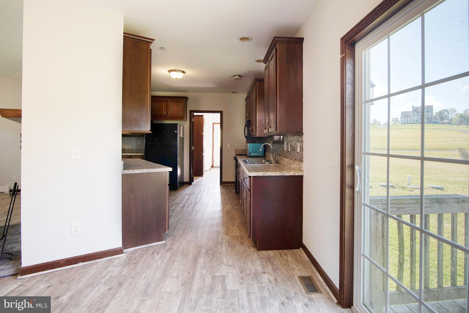 1668 Colora Road Colora, MD 21917 - Photo 7 of 29 Dining Area into the Kitchen