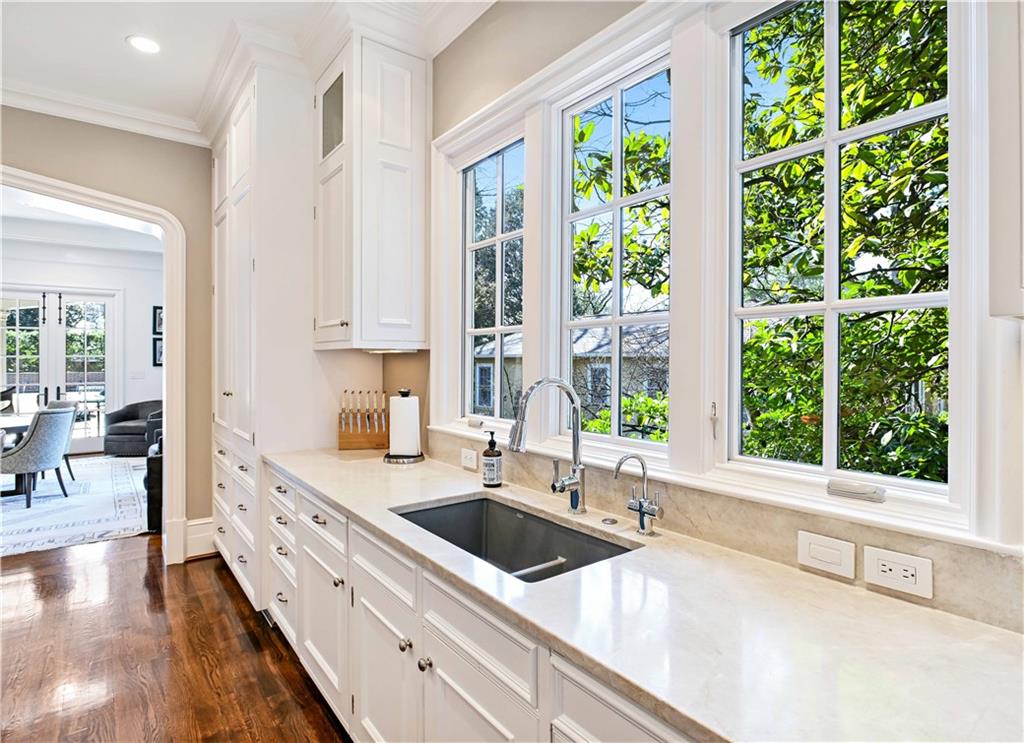 369 Pine Tree Drive Northeast Atlanta, GA 30305 - Photo 20 of 103 a kitchen with stainless steel appliances a sink and a large window