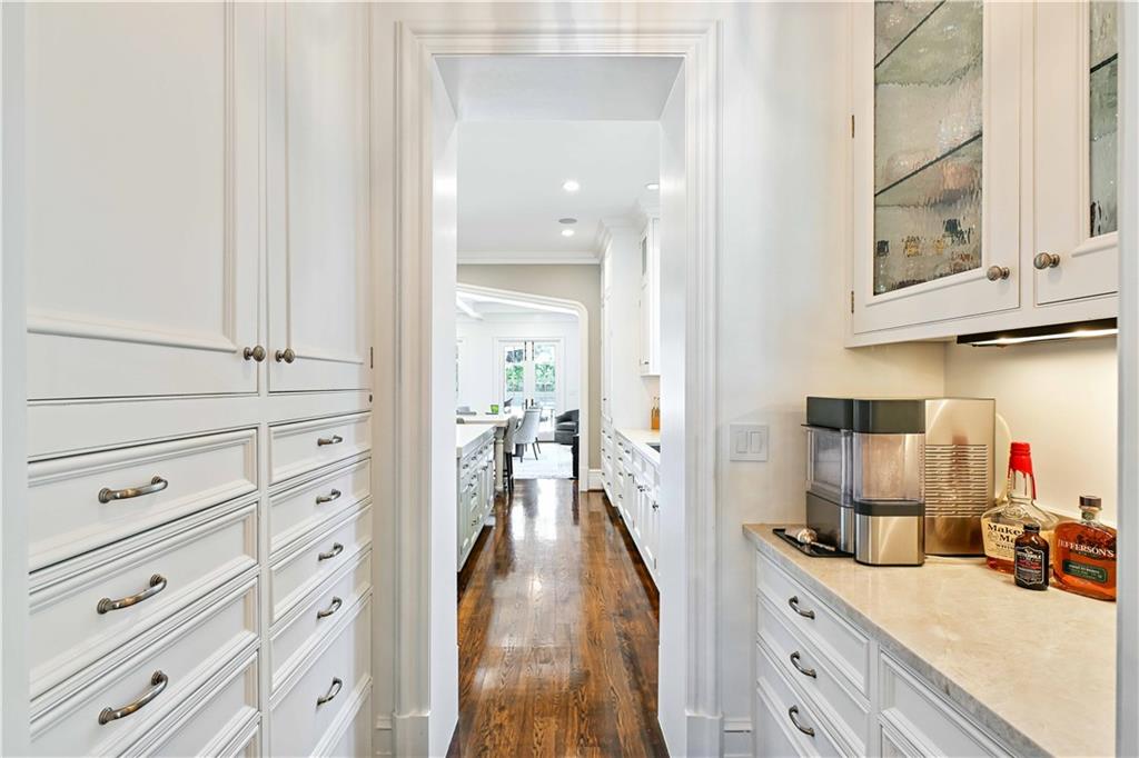 369 Pine Tree Drive Northeast Atlanta, GA 30305 - Photo 22 of 103 a view of a kitchen with cabinets and wooden floor