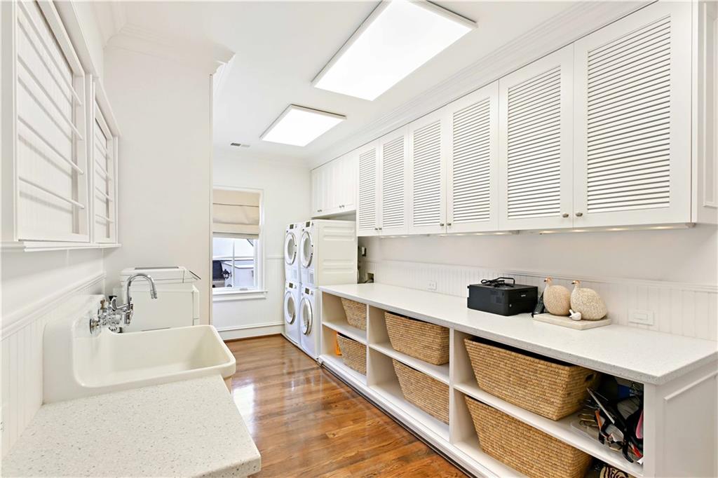 369 Pine Tree Drive Northeast Atlanta, GA 30305 - Photo 48 of 103 a kitchen with white cabinets and sink