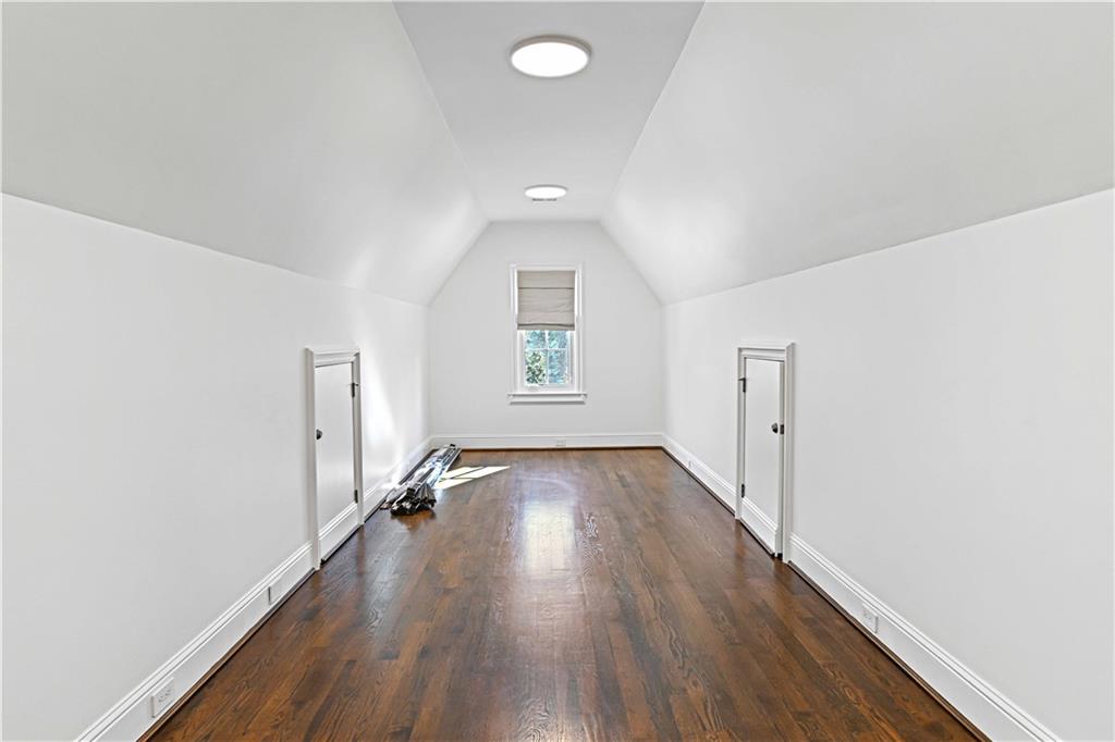 369 Pine Tree Drive Northeast Atlanta, GA 30305 - Photo 64 of 103 wooden floor in an empty room with a window