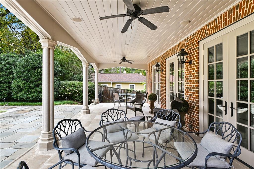 369 Pine Tree Drive Northeast Atlanta, GA 30305 - Photo 87 of 103 a view of a patio with table and chairs