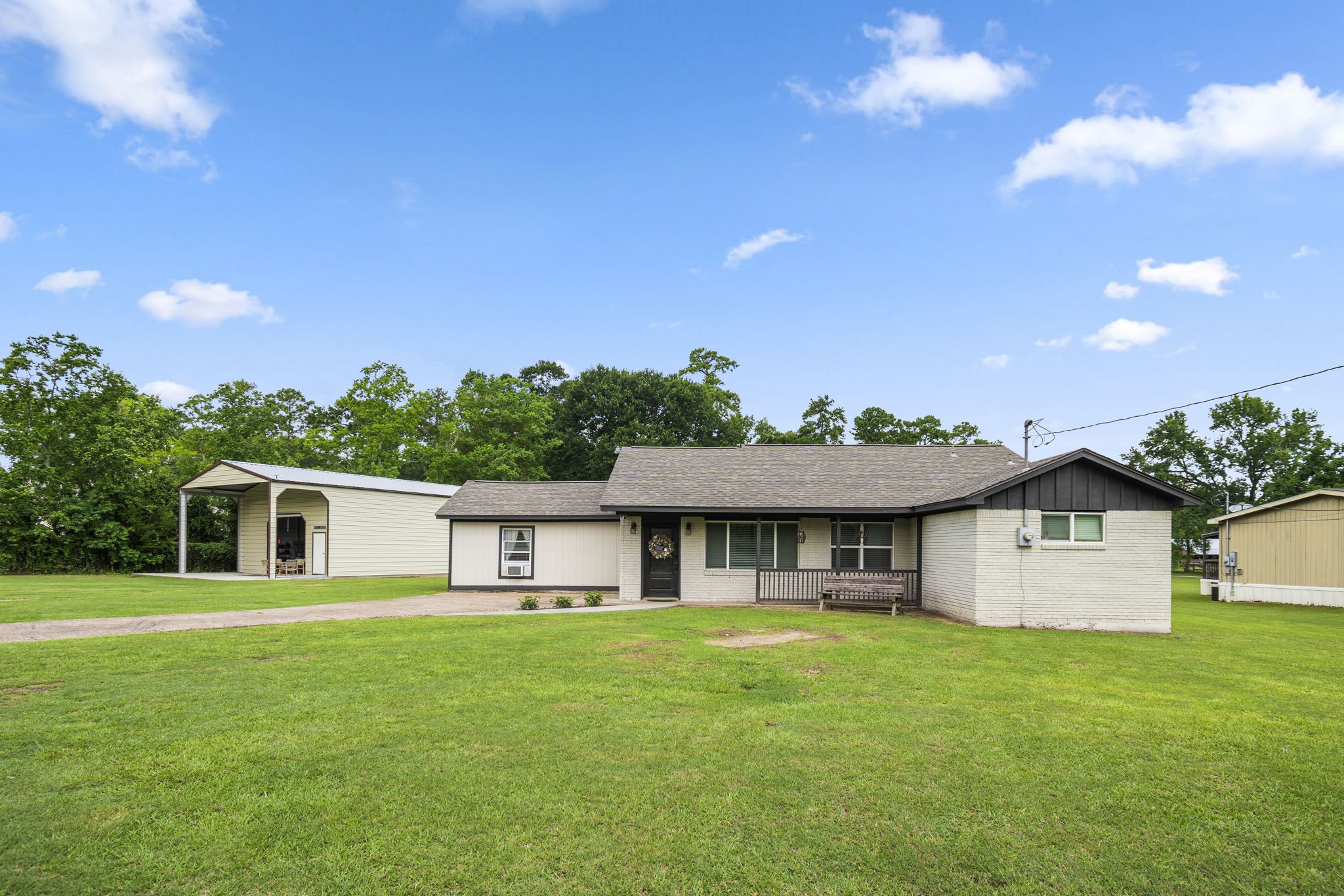 25311 Hardin Store Road Pinehurst, TX 77362 - Photo 29 of 39 a front view of a house with a garden