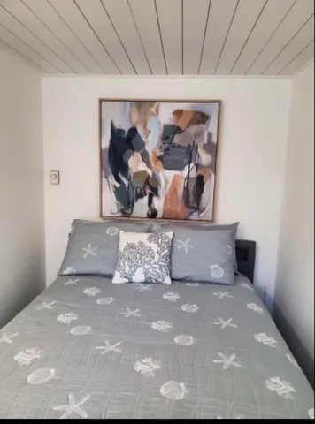 a room with a dresser and a window