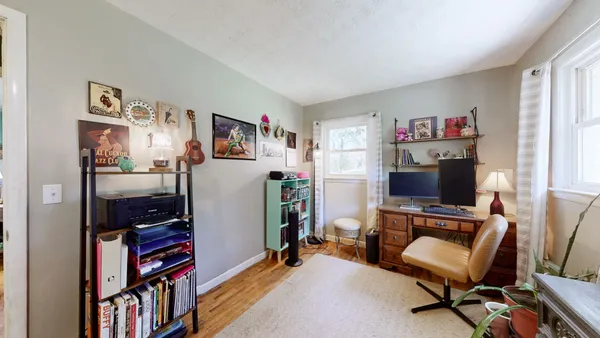 a room with furniture and a flat screen tv
