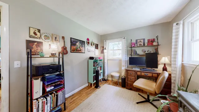 a room with furniture and a flat screen tv