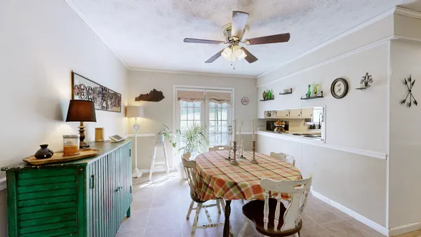 a dining room with furniture and window