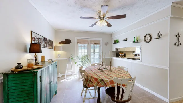 a dining room with furniture and window