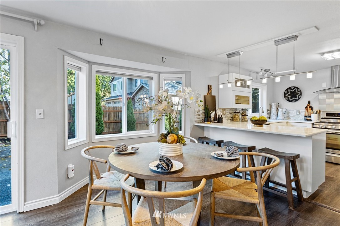 915 215th Street Southeast Bothell, WA 98021 - Photo 16 of 33 a kitchen with a table and chairs in it