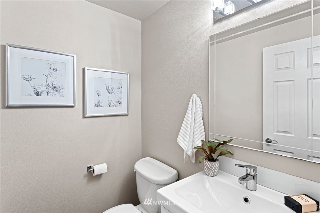 915 215th Street Southeast Bothell, WA 98021 - Photo 17 of 33 a bathroom with a toilet sink and mirror