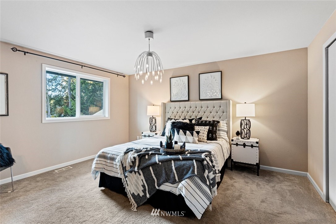 915 215th Street Southeast Bothell, WA 98021 - Photo 18 of 33 a bedroom with bed and a window