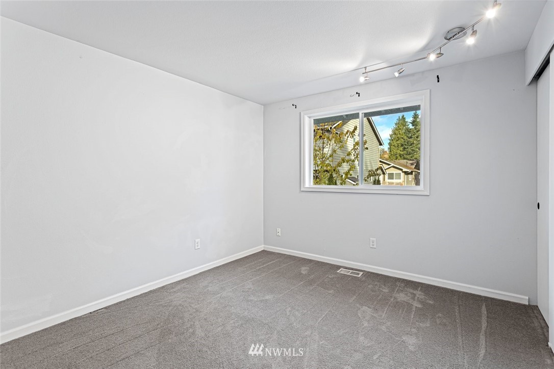 915 215th Street Southeast Bothell, WA 98021 - Photo 25 of 33 an empty room with windows