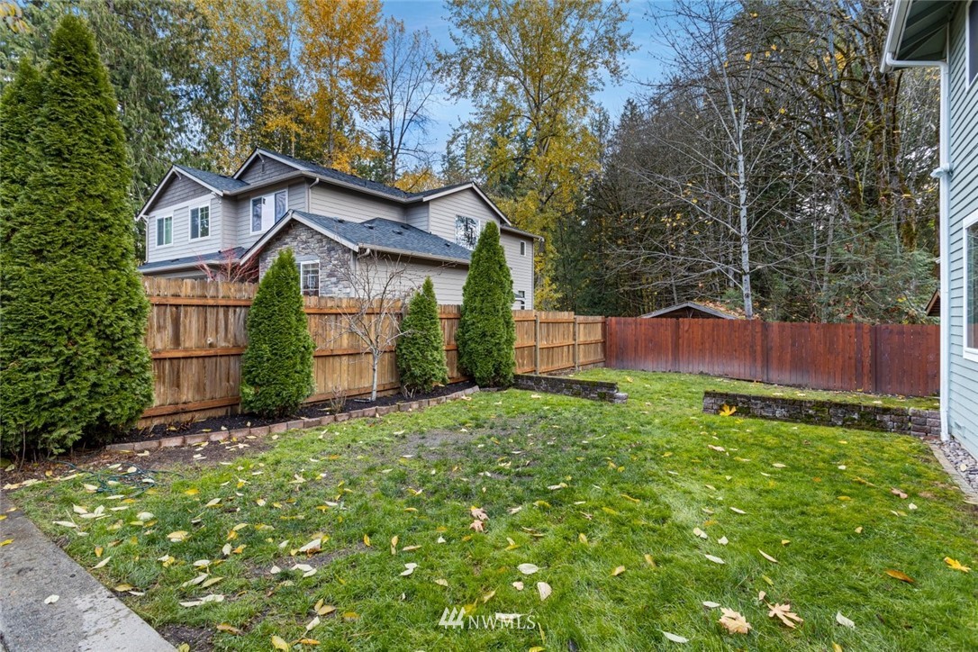 915 215th Street Southeast Bothell, WA 98021 - Photo 31 of 33 a front view of a house with garden