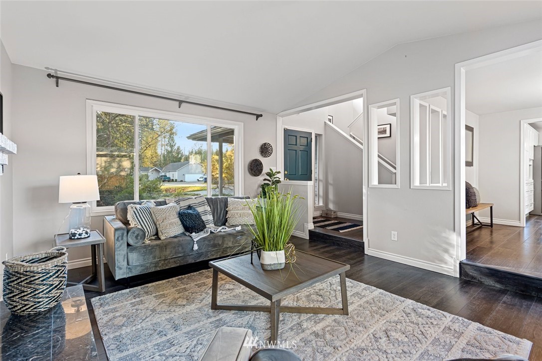 915 215th Street Southeast Bothell, WA 98021 - Photo 6 of 33 a living room with furniture and a large window