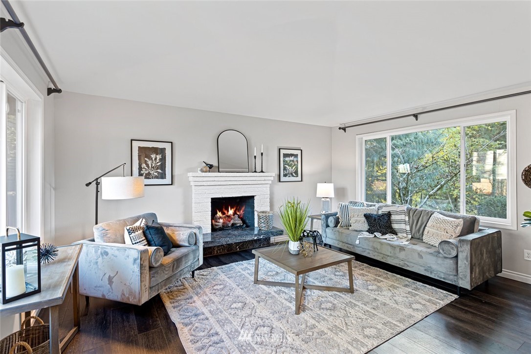 915 215th Street Southeast Bothell, WA 98021 - Photo 7 of 33 a living room with furniture and a fireplace