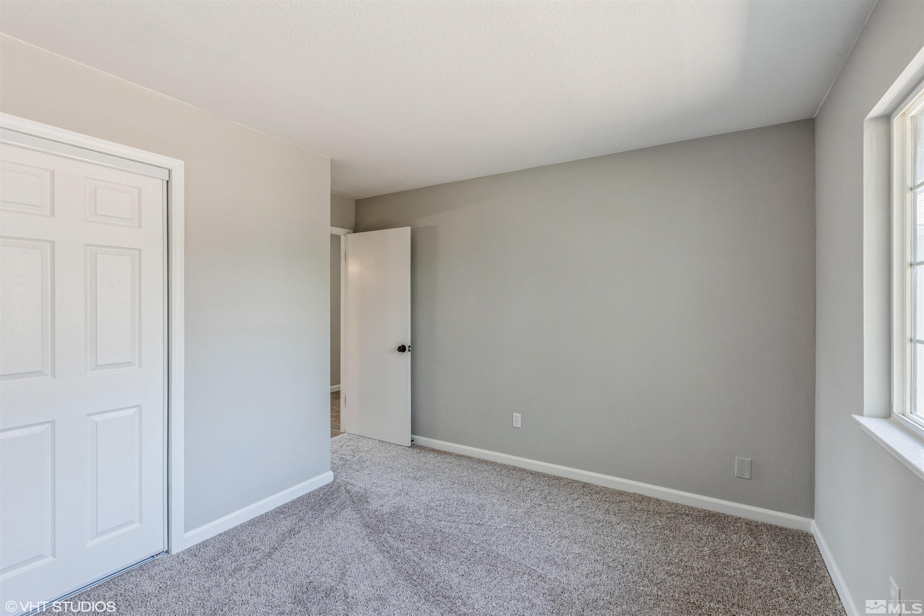 1930 Stardust Street Reno, NV 89503 - Photo 8 of 15 a view of an empty room and a window