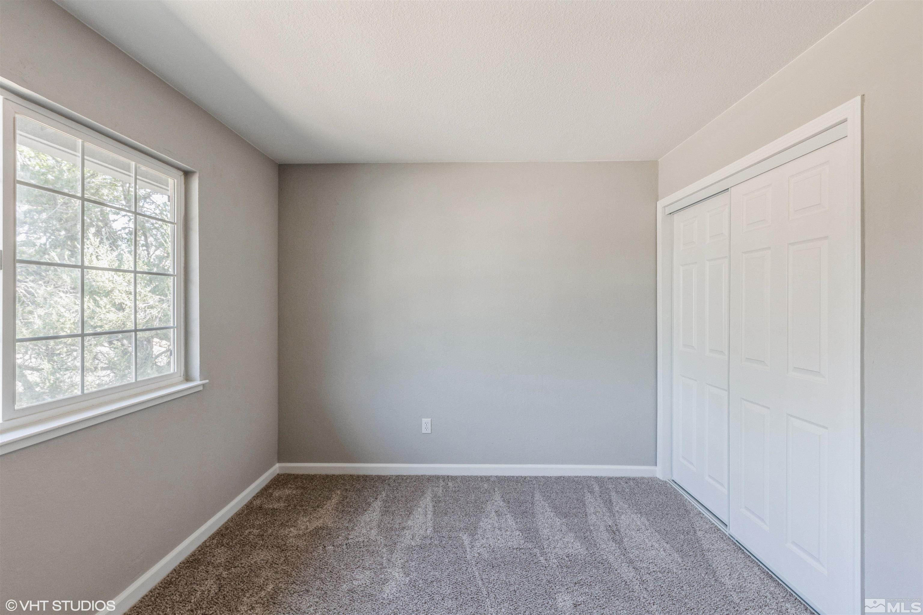 1930 Stardust Street Reno, NV 89503 - Photo 9 of 15 an empty room with windows