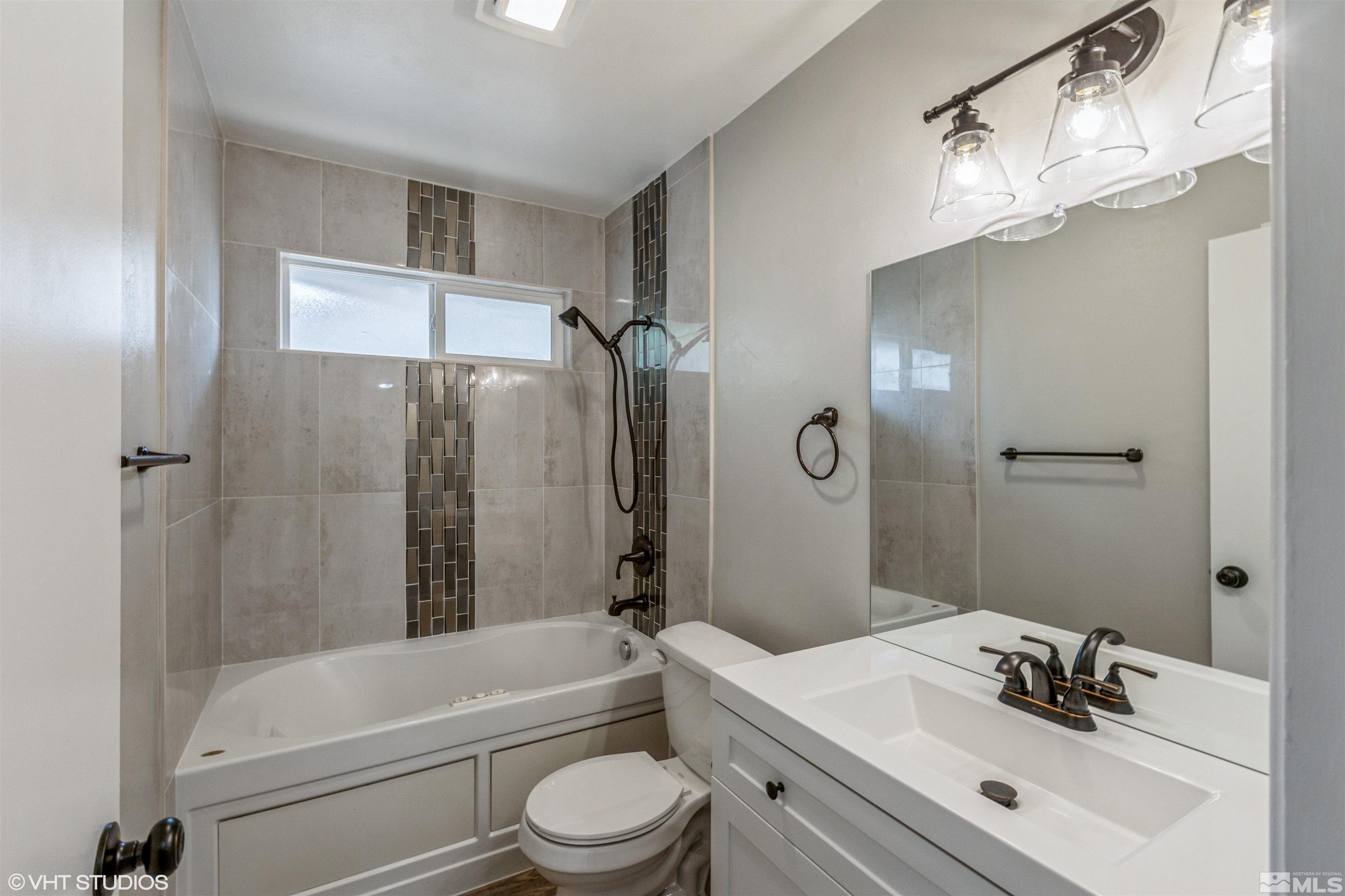1930 Stardust Street Reno, NV 89503 - Photo 10 of 15 a bathroom with a sink a toilet and shower