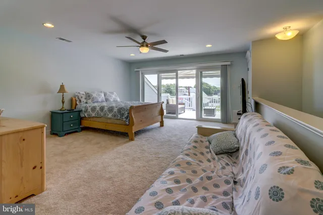 a bed room with a bed and a window