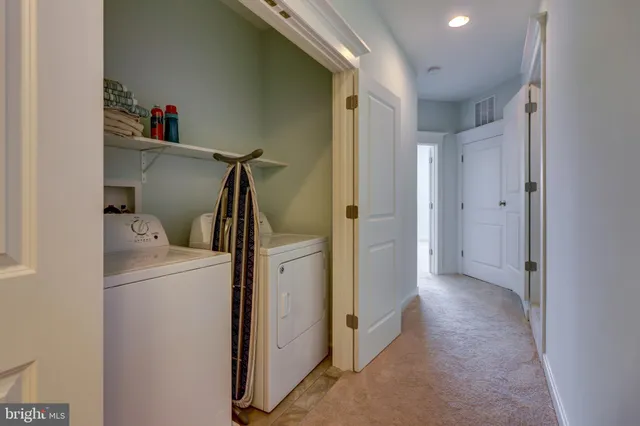 a view of hallway with washer and dryer