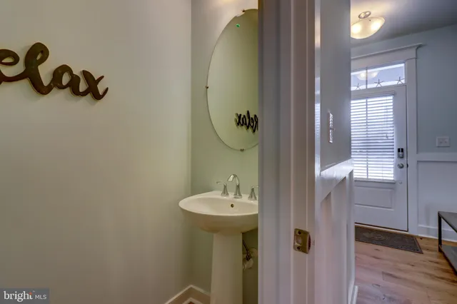a bathroom with a sink and mirror