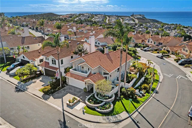 an aerial view of a house with a swimming pool