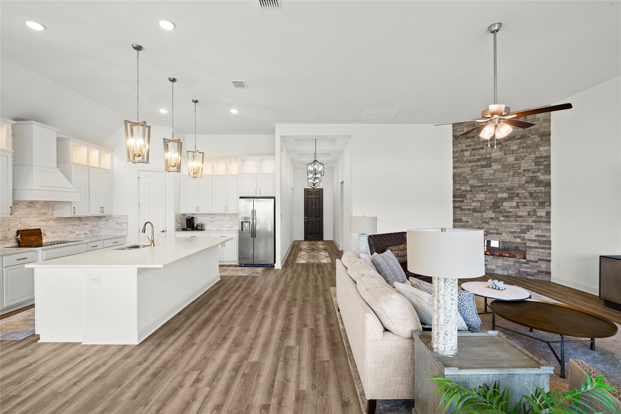 101 Bosco Road Hutto, TX 78634 - Photo 11 of 34 a large white kitchen with cabinets