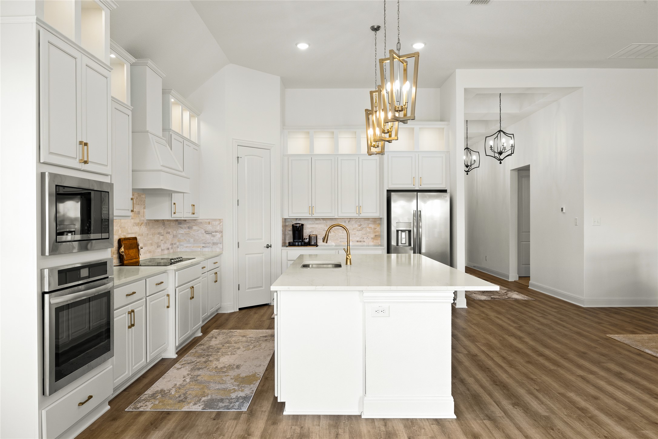 101 Bosco Road Hutto, TX 78634 - Photo 16 of 34 a kitchen with a sink stove and refrigerator