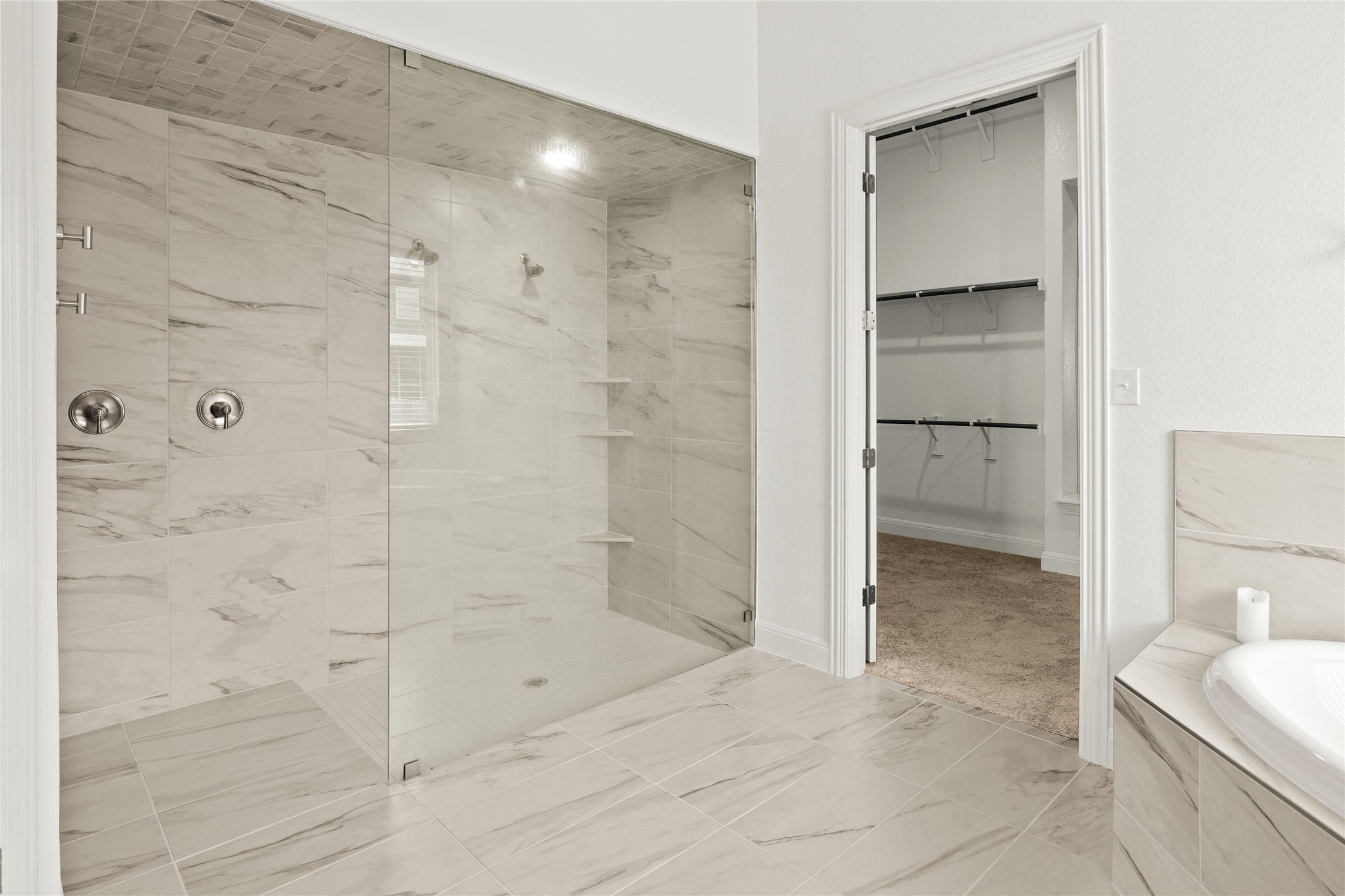 101 Bosco Road Hutto, TX 78634 - Photo 21 of 34 a bathroom with a shower and a glass door