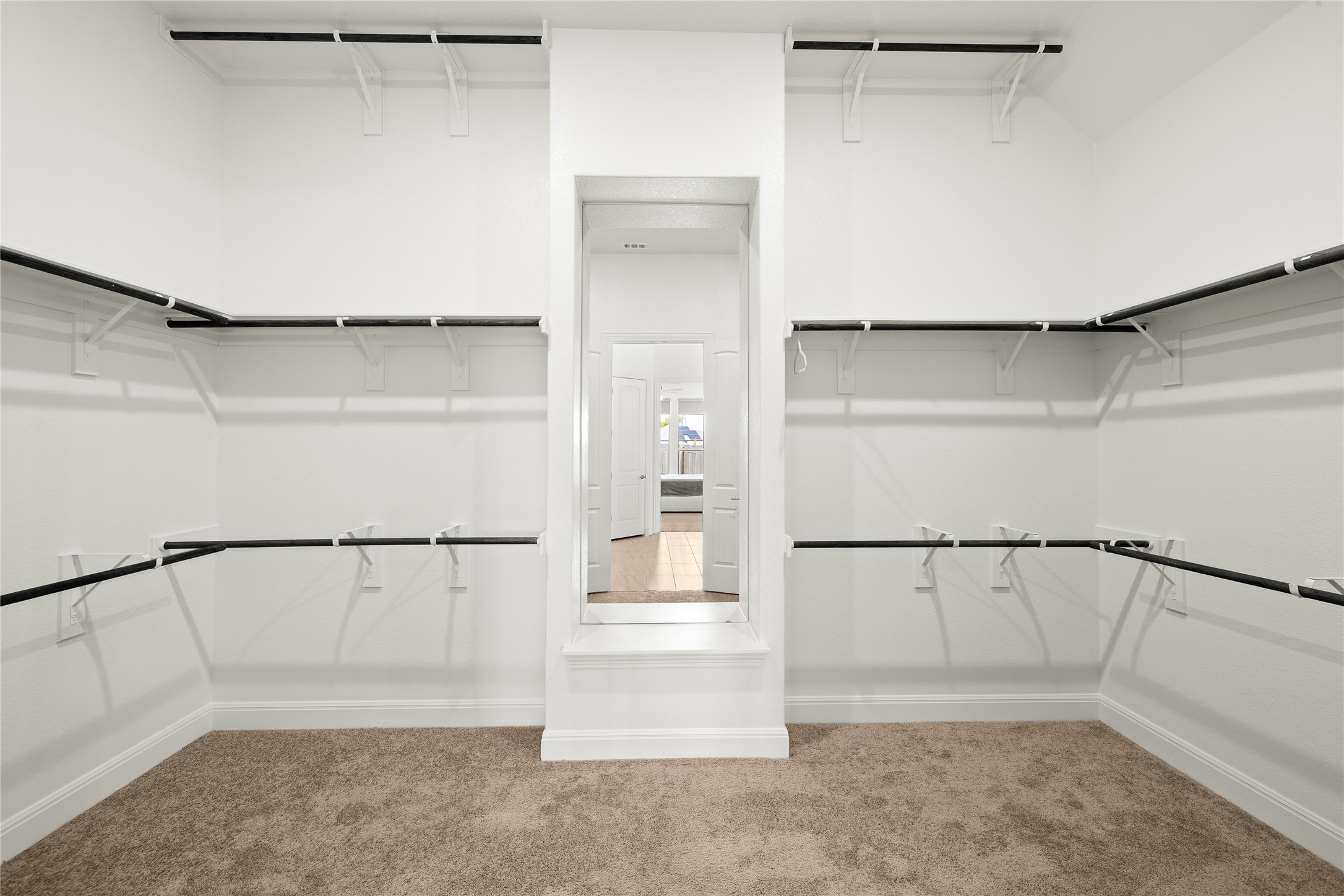 101 Bosco Road Hutto, TX 78634 - Photo 22 of 34 a view of walk in closet with empty racks