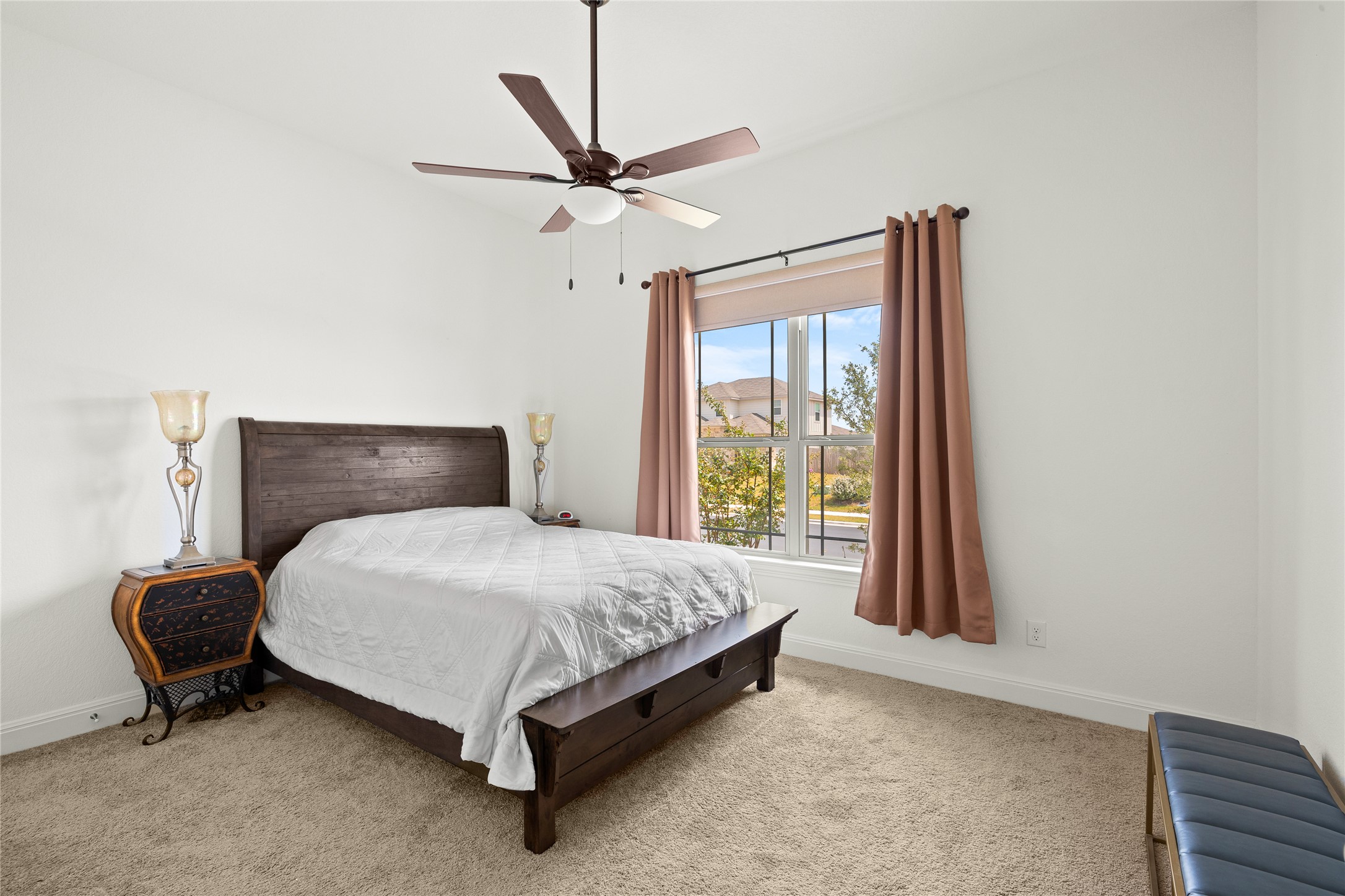 101 Bosco Road Hutto, TX 78634 - Photo 23 of 34 a bedroom with a bed and a window