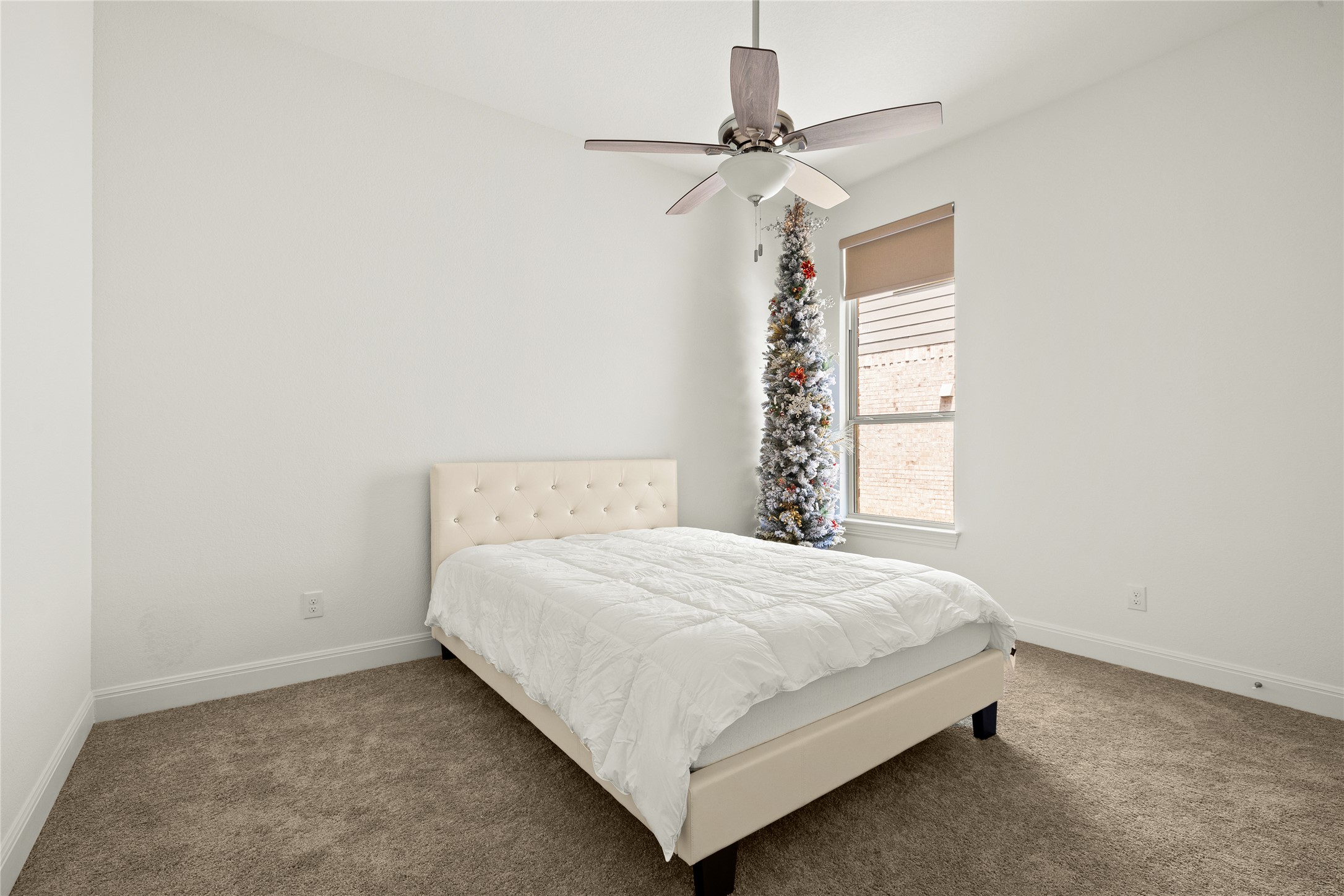 101 Bosco Road Hutto, TX 78634 - Photo 24 of 34 a bedroom with a bed and window