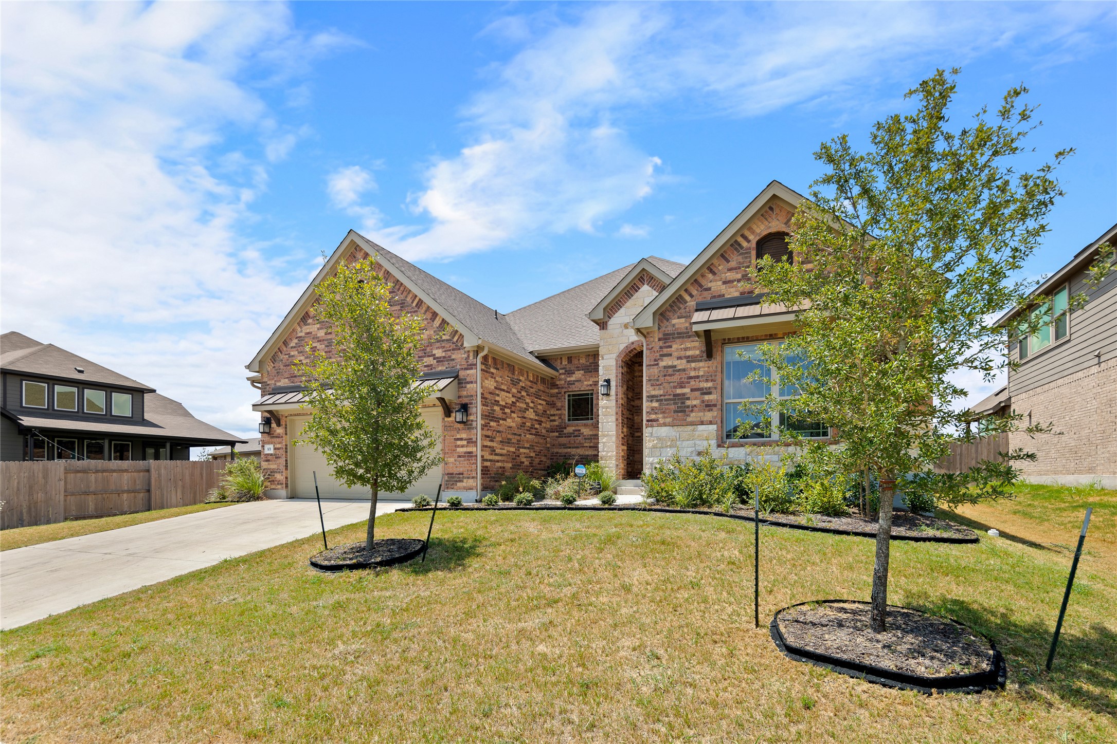 101 Bosco Road Hutto, TX 78634 - Photo 3 of 34 a view of a house with swimming pool and sitting area