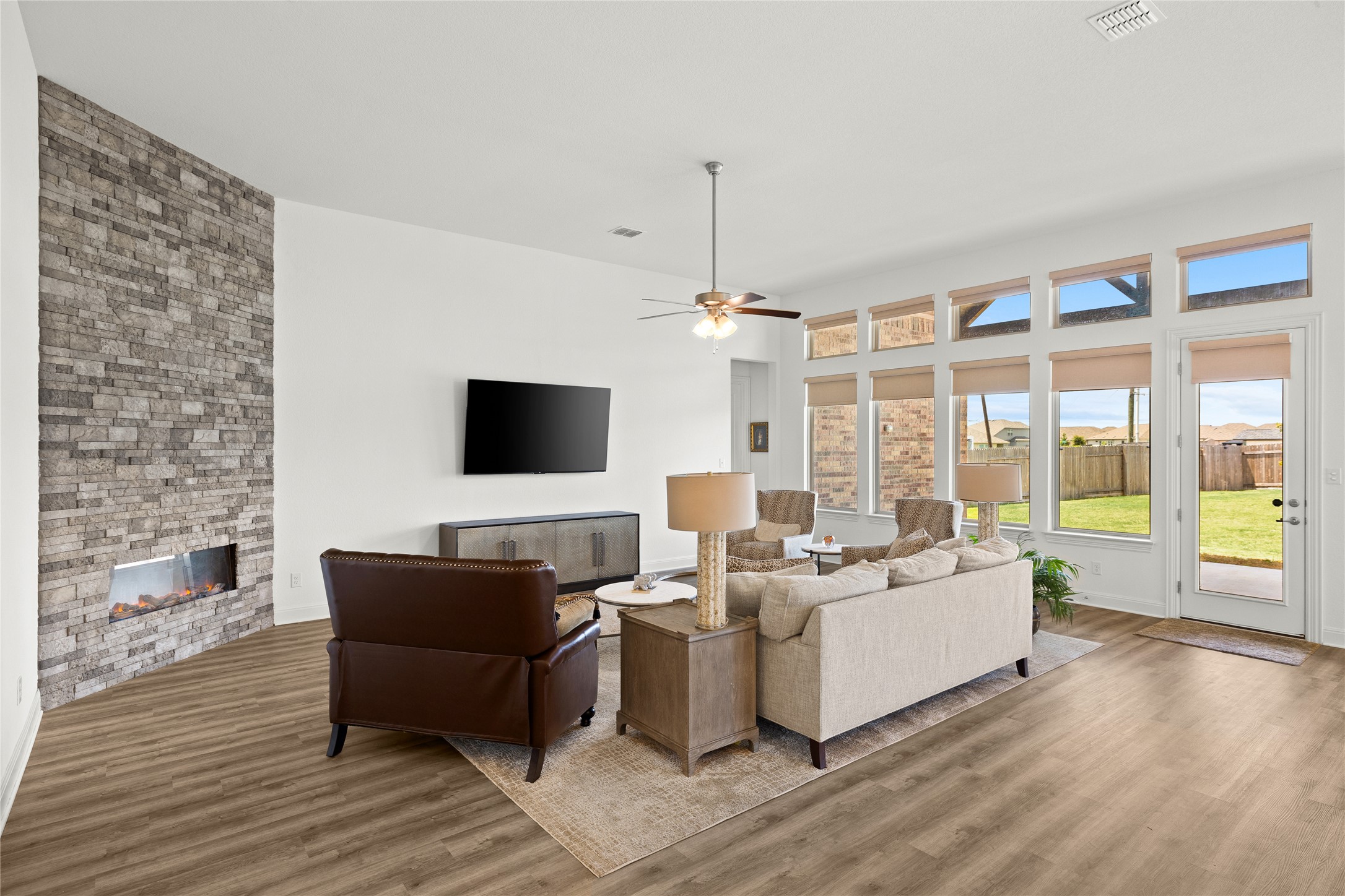 101 Bosco Road Hutto, TX 78634 - Photo 7 of 34 a living room with furniture wooden floor and a flat screen tv