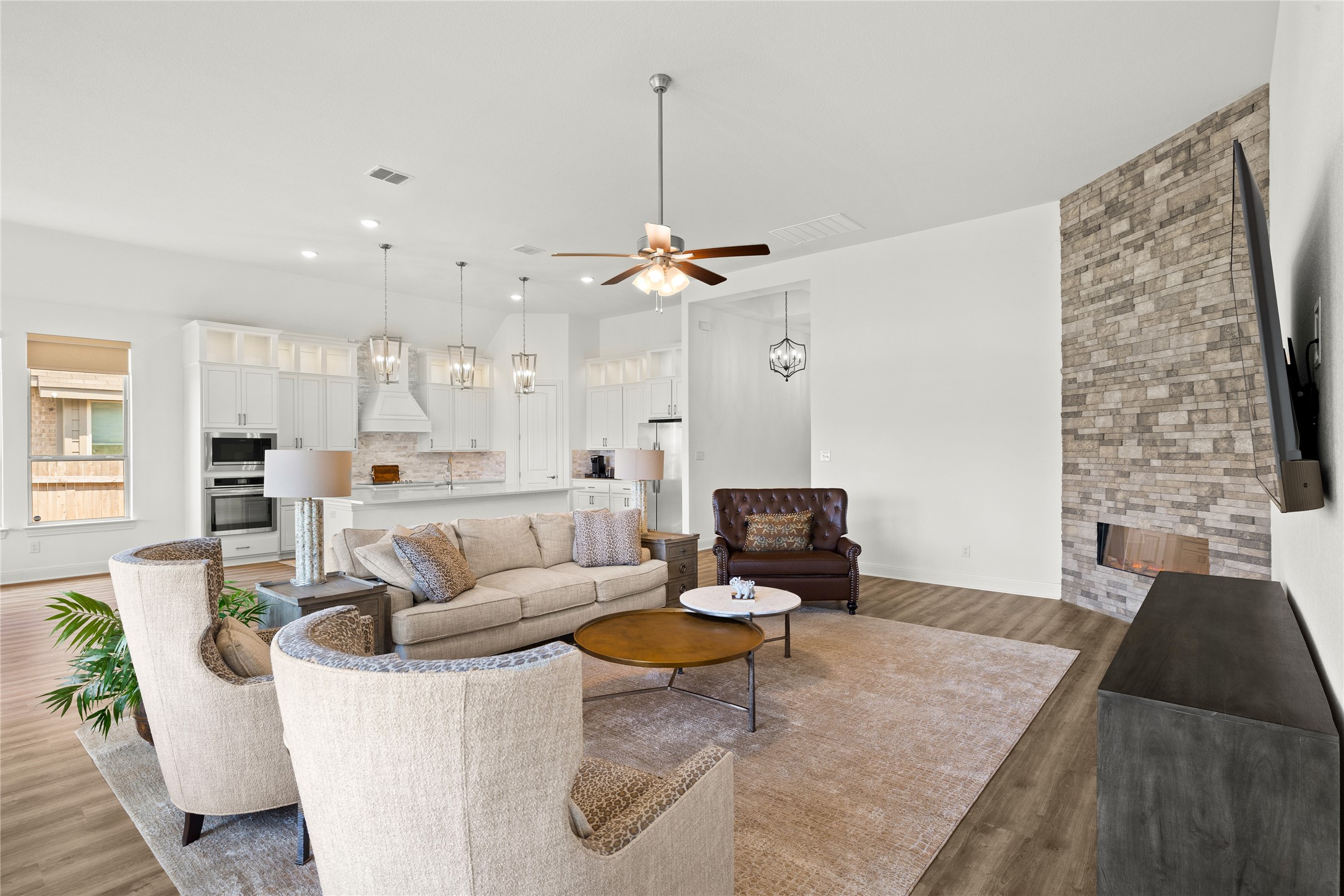 101 Bosco Road Hutto, TX 78634 - Photo 10 of 34 a living room with furniture and kitchen view