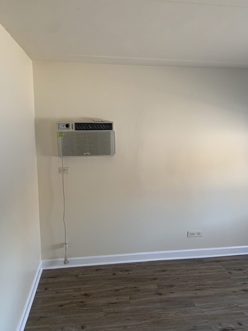 264 East Bailey Road, Unit C Naperville, IL 60565 - Photo 16 of 30 a view of a room with wooden floor