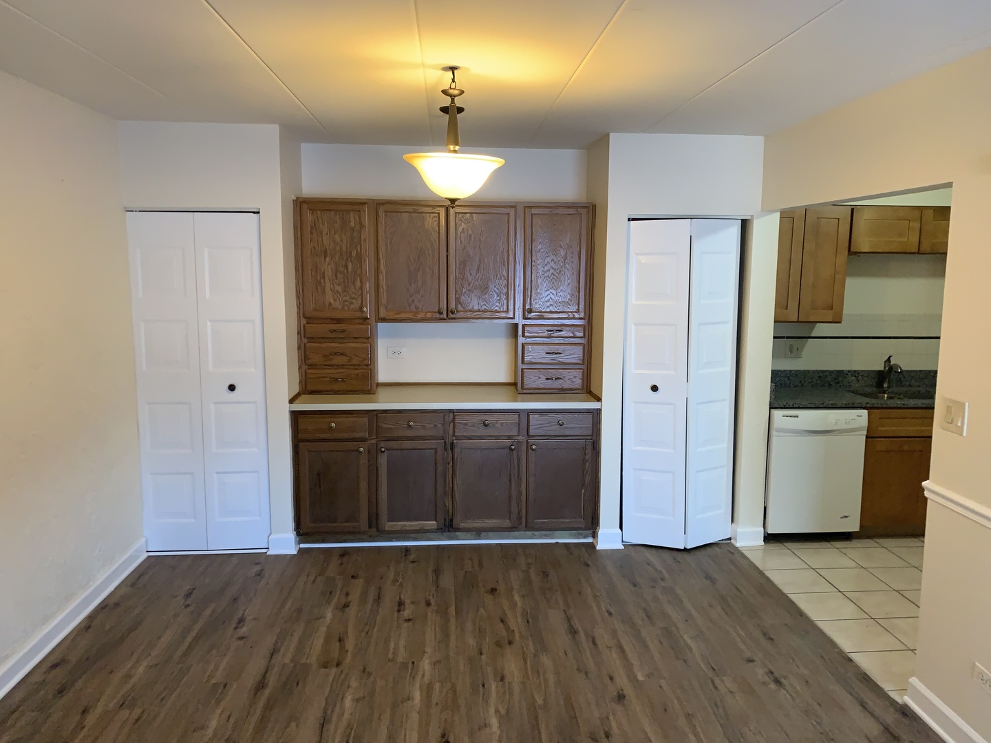 264 East Bailey Road, Unit C Naperville, IL 60565 - Photo 7 of 30 a kitchen with wooden floors and refrigerator