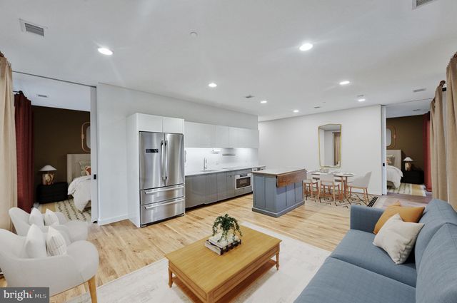 a view of a livingroom with furniture and wooden floor