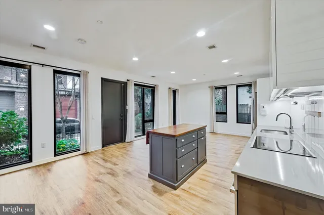 a view of an empty room and wooden floor