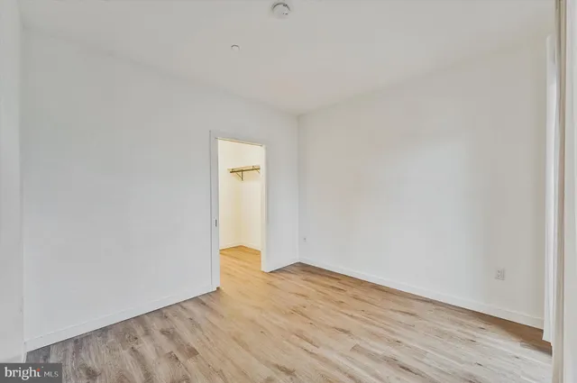 a view of a livingroom with furniture and wooden floor