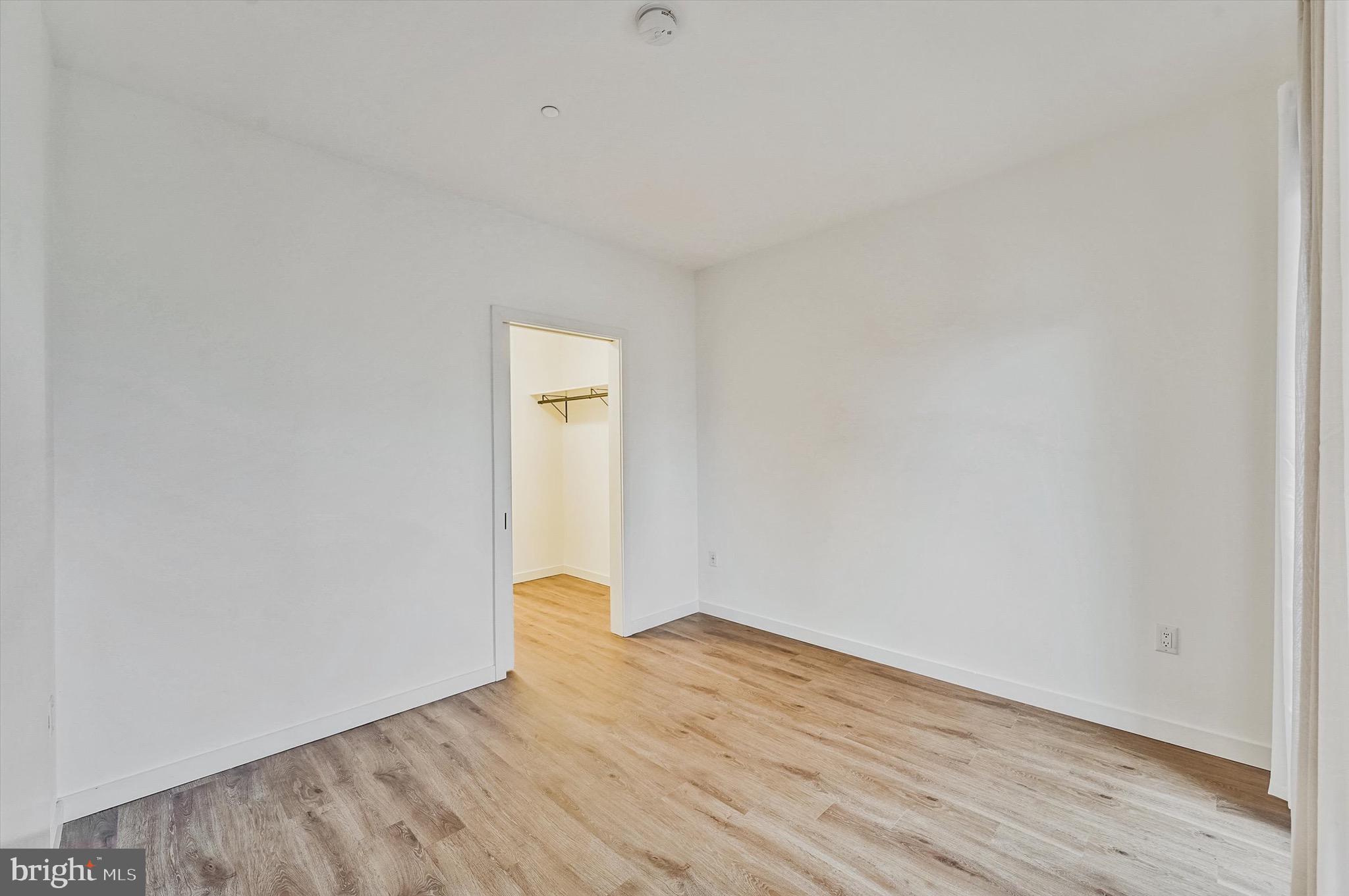 57 N Street Northwest, Unit 125 Washington, DC 20001 - Photo 18 of 56 a view of an empty room and wooden floor