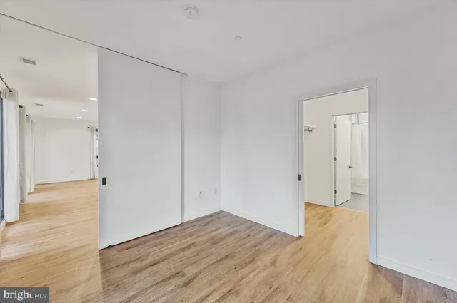 a view of a livingroom with wooden floor